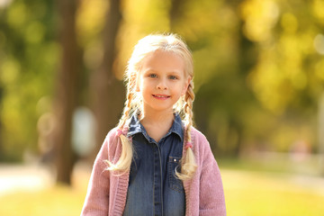 Cute little girl in autumn park