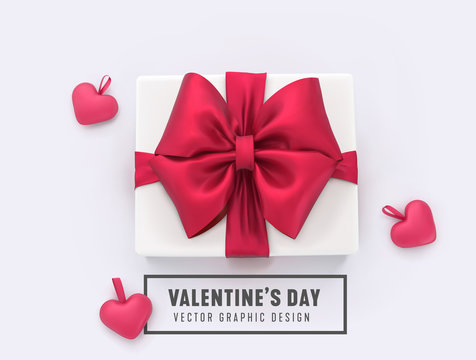 Happy Valentines day vector concept. Gift box with red ribbon bow and hearts. Top view.