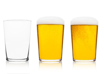 Cold glasses of lager ale beer with foam