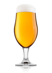 Cold glass of lager ale beer with foam and dew