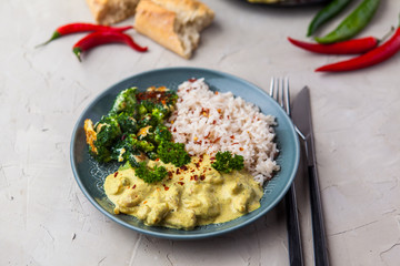 Handmade chicken curry tikka masala with basmati rice and brocco