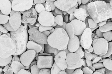 large grey pebble occupies the entire space of the frame, grey tone