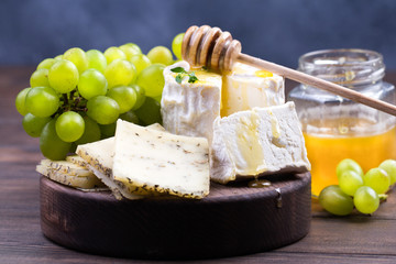 French cheeses on wooden table