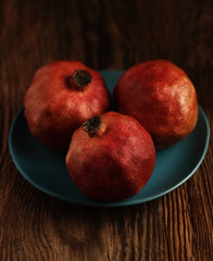 Fototapeta na wymiar three pomegranate in the bowl