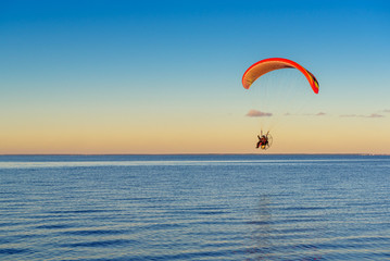 Flying paraglider over the Baltic sea. Rewa, Poland.