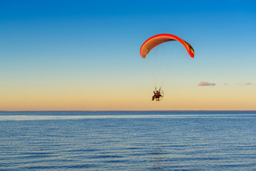 Flying paraglider over the Baltic sea. Rewa, Poland.