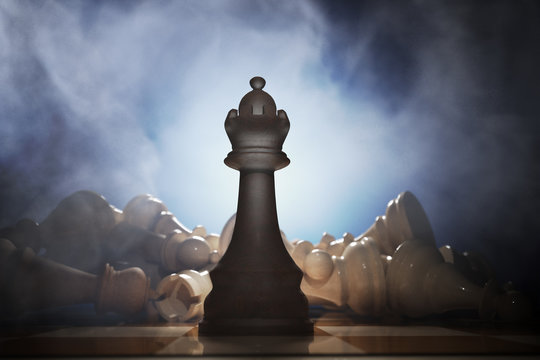 Victory in chess. Queen in front and many dead pieces in background. 3D rendered illustration.