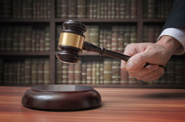 Justice and law concept. Lawyer is hitting with gavel.