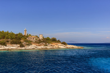 Fototapeta na wymiar Fiscardo Venetian lighthouse and Byzantine Church. Kefalonia Greece
