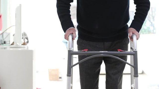 Close Up Of Senior Man Using Walking Frame At Home