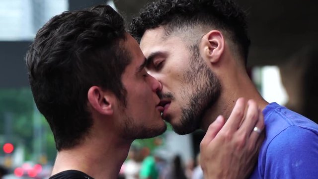 Gay Couple Kissing on city background