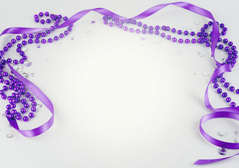 Purple beads and ribbon and sparkly jewels on a light background make a border for International Women's Day on March 8th each year. Copy space