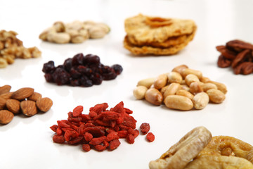 piles of Mixed dried fruits and nuts - symbols of jewish holiday Tu Bishvat
