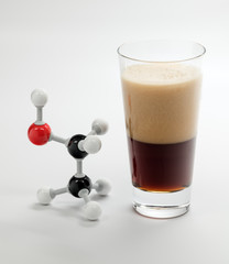 Chemistry molecule model of Ethanol next to some beer