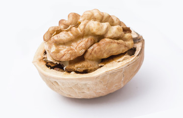 Walnut cracked in shell isolated on white.