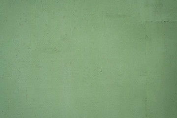 Old iron surface is painted green paint - bright rustic metal background