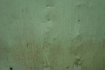 Old iron surface is painted green paint - bright rustic metal background