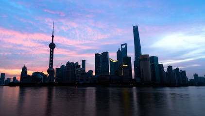 Naklejka premium Sunrise twilight sky of Shanghai skyline Pudong building most prosperous urban groups of panoramic view in the morning. Shanghai China City scape of business district trade zone.