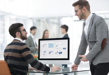 two businessmen analyzing stats financial data