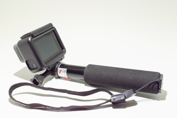 Toledo, Spain - January 6, 2.018: GoPro Hero 6 Black Edition on a selfie stick isolated on white background. Action camera