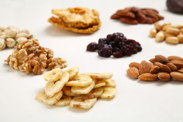 piles of Mixed dried fruits and nuts - symbols of jewish holiday Tu Bishvat