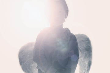 Angel in sun rays (the choice between good and evil, the conscience, the sin concept)