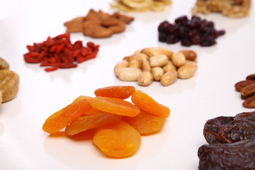 piles of Mixed dried fruits and nuts - symbols of jewish holiday Tu Bishvat