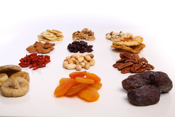 piles of Mixed dried fruits and nuts - symbols of jewish holiday Tu Bishvat