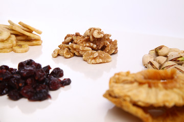 piles of Mixed dried fruits and nuts - symbols of jewish holiday Tu Bishvat