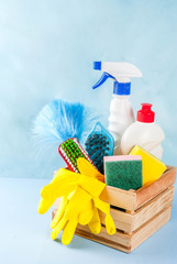 Spring cleaning concept with supplies, house cleaning products pile. Household chore concept, on...
