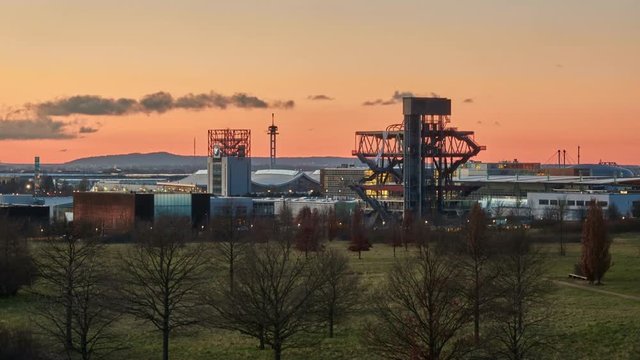 Silhouette of east territory of the exhibition center in Hanover in the January evening. Time lapse. 4K.
