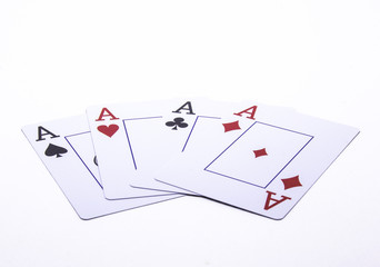 Four aces against a white background