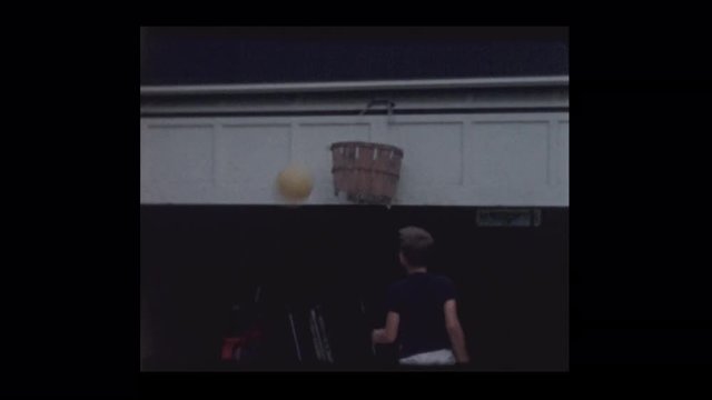 1962 Little boys shooting hoops into old crate basket
