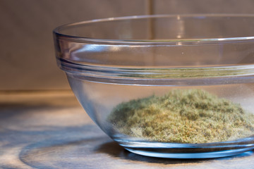 ground cannabis flower in a clear glass bowl.