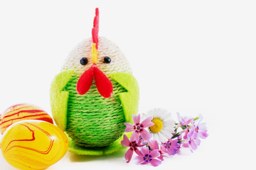 Happy Easter. Colorful easter chick, eggs and yellow feather