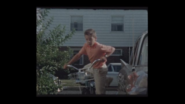 1963 Good looking young boy on bicycle
