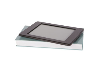 Ebook reader tablet with blankscreen on top of a paper book. Isolated on white.