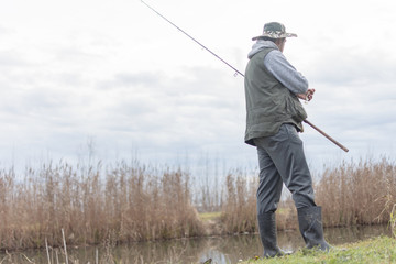 A man enjoys in the free time he spends himself on fishing