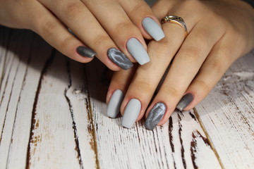 Obraz na płótnie Canvas manicure in gray with