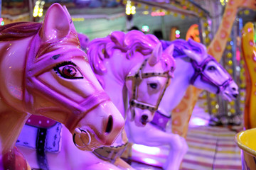 Carousel horses in a carnival in Portugal.