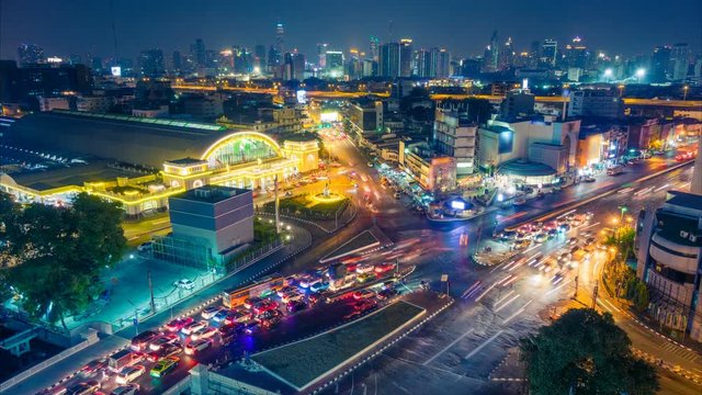 Bangkok night skyline. Aerial cityscape. Time lapse with traffic and blurred traces from cars