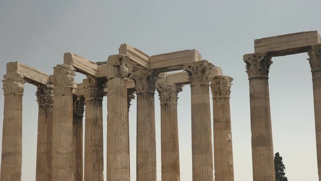 left to right panning shot of the columns of the temple of zeus in athens, greece