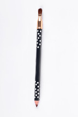 Brown pencil for eyes. Decorative cosmetic liner for beautiful makeup. Professional eyeliner, white background.