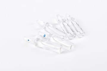 Medical ampoules on white background. Set of glass ampoules with liquid on white background. Medicine and health care.