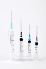 Set of disposable medical syringe. Empty plastic syringes isolated on white background, vertical image.