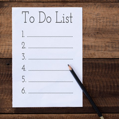 empty to do list with pencil on wooden table.lifestyle concept