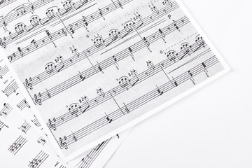 Music sheets on white background. Sheets with musical notes isolated on white background.