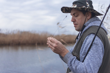 A man enjoys in the free time he spends himself on fishing