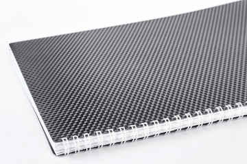 Black spiral notepad, white background. New spiral binder notebook isolated on white background. Notepad with clipping path.