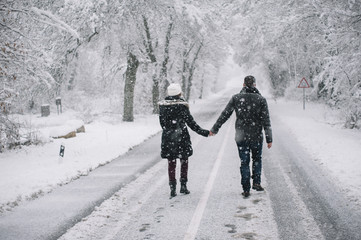 wedding couple walking in the snow